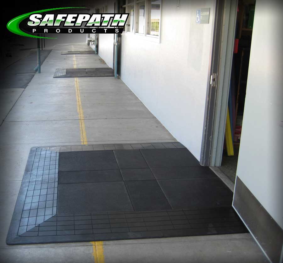 Door entryway threshold ramp and level landing for ADA compliant wheelchair accessibility to school classrooms